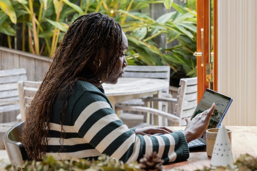 A woman sitting at her laptop.